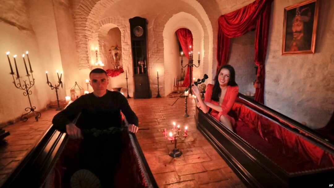 Tami Varma (R) and her brother Robin, grandchildren of an expert in vampire lore, pose in coffins at Dracula's Castle, in Bran, Romania, Oct. 31, 2016. The pair bested 88,000 people in a competition to win the chance of a night at the famed landmark.