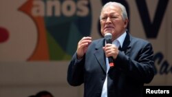 FILE - El Salvador's President Salvador Sanchez Ceren participates in a rally outside the Salvadoran congress building after his third State of the Nation address in San Salvador, El Salvador, June 1, 2017.