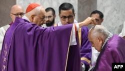 A cardinal sprinkles ashes on the head of Pope Francis during the celebration of Ash Wednesday Mass on Feb. 14, 2024, at the Basilica of Santa Sabina in Rome. (Vatican Media vis AFP)