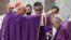 A cardinal sprinkles ashes on the head of Pope Francis during the celebration of Ash Wednesday Mass on Feb. 14, 2024, at the Basilica of Santa Sabina in Rome. (Vatican Media vis AFP)