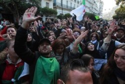 Algerian demonstrators take to the streets in the capital Algiers to reject the presidential elections, in Algeria, Dec. 12, 2019.