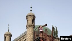 Imam calls Muslim Uighurs for afternoon prayer in China's Xinjiang region in this 2012 photo.