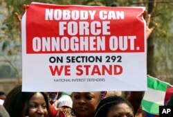 People protest at the secretariat of the Nigerian Bar Association following the suspension of Nigeria's Chief Justice Walter Onnoghen, in Abuja, Nigeria, Jan. 28, 2019.