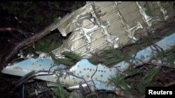 A view of the wreckage of a warplane, probably belonging to the Syrian air force, that crashed on the Turkish side of the border with Syria on Saturday, is seen in this still image taken from video, March 4, 2017. 