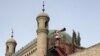 Imam calls Muslim Uighurs for afternoon prayer in China's Xinjiang region (2012 photo)