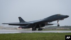 In this photo released by the U.S. Air Force, a B-1B Lancer bomber assigned to 37th Expeditionary Bomb Squadron, deployed from Ellsworth Air Force Base, South Dakota, takes off from Andersen Air Force Base, Guam, Sept. 9, 2017. 