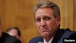 U.S. Senator Jeff Flake (R-AZ) looks on during a Senate Judiciary Committee confirmation hearing for U.S. Supreme Court nominee Brett Kavanaugh on Capitol Hill in Washington, Sept. 27, 2018.