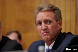 U.S. Senator Jeff Flake (R-AZ) looks on during a Senate Judiciary Committee confirmation hearing for U.S. Supreme Court nominee Brett Kavanaugh on Capitol Hill in Washington, Sept. 27, 2018.