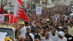 Thousands chant anti-government slogans as they march during a funeral procession for Sayed Hameed Mahfoodh, 61, whom relatives allege was killed by police, in the western Shi'ite Muslim village of Saar, Bahrain, April 6, 2011