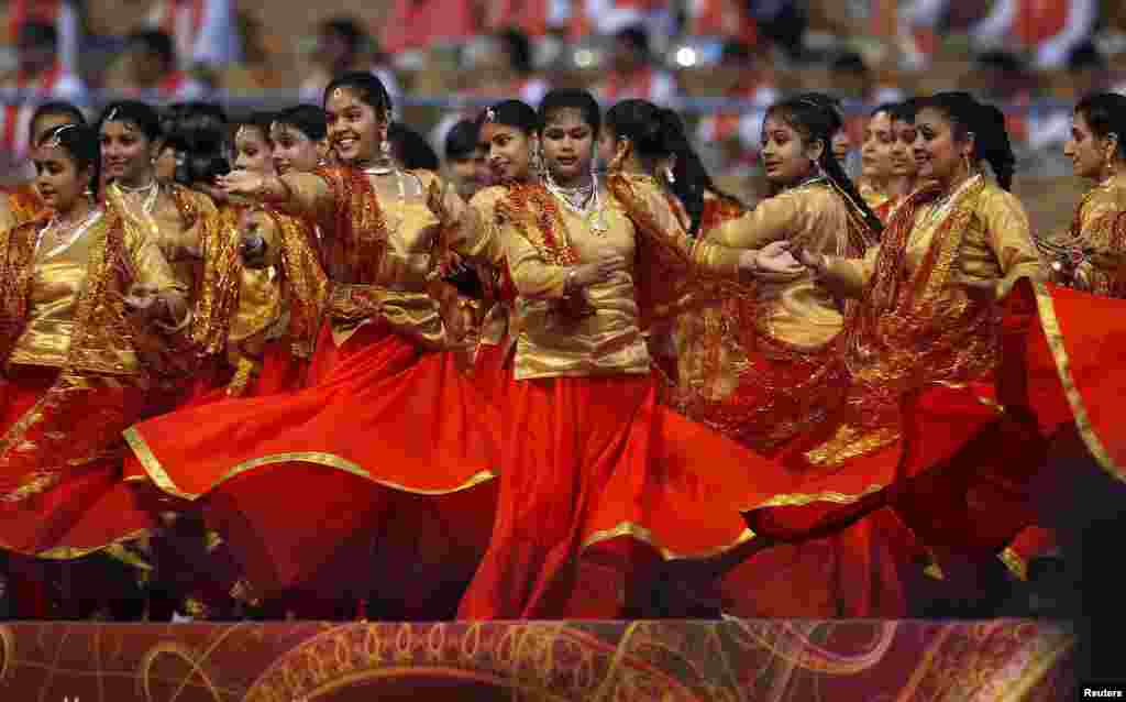 Participants perform at a venue of the World Culture Festival on the banks of a river in New Delhi, India.