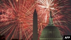 FILE - Fireworks explode over the National Mall as the US Capitol (R) and National Monument are seen on July 4, 2017, in Washington, DC. 
