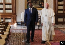 FILE - Pope Francis meets Congo President Joseph Kabila during a private audience in the pontiff's studio, at the Vatican, Sept. 26, 2016.