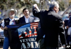 Latino, Arab-American businessman Ammar Campa-Najjar (center) ran for Congress in Southern California's 50th district, pictured Oct. 16, 2018, in San Diego.