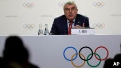 International Olympic Committee President Thomas Bach speaks at press conference in Buenos Aires, Argentina, Oct. 4, 2018. He said then that Calgary, Stockholm and a pair of Italian cities would be proposed as official candidates for approval to host the 2026 Winter Games. A committee in Calgary is now recommending that the city drop out.