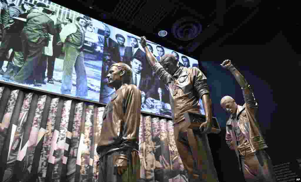 A statue of the 1968 Olympics Black Power salute is on display at the National Museum of African American History and Culture in Washington, Sept. 14, 2016.