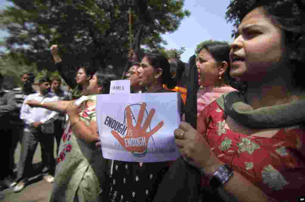 Indian activists of &quot;Mahila Morcha&quot; shout slogans during a protest in Jammu. A second suspect was arrested Monday in the rape of a 5-year-old girl, a case that has brought a new wave of protests over how Indian authorities handle sex crimes.