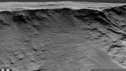 Geological formations are seen in sedimentary rock in the Hellas Basin on Mars. Researchers say these well-exposed channels are archived evidence of long-lived rivers active on the Martian surface over 3.7 billion yrs ago. (HiRISE image/Credit: NASA/JPL-C