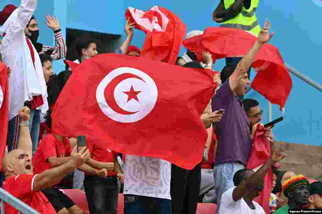 Tunisian supporters cheer their team.