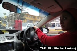 Faridah Khamis, 36, single mother of five children drives her cab through the streets of Nairobi, Kenya, April 19, 2018.