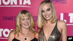 Tonya Harding, left, and Margot Robbie arrive at the Los Angeles premiere of "I, Tonya" at the Egyptian Theatre on Tuesday, Dec. 5, 2017. (Photo by Jordan Strauss/Invision/AP)