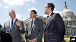 Rep. Jeff Denham, R-Calif., left, speaks next to Rep. David Valadao, R-Calif., and Rep. Will Hurd, R-Texas, during a news conference with House Republicans who are collecting signatures on a petition to force House votes on immigration legislation on Capitol Hill in Washington, May 9, 2018. 