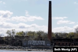 An old building shows a warning sign on Hart Island in New York.