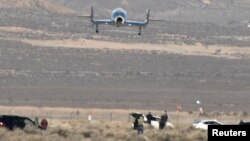 The SpaceShipTwo VSS Unity passenger craft makes its final approach for a landing at Mojave Air and Space Port in Mojave, California, Feb. 22, 2019. 