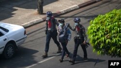 Police arrest Myanmar Now journalist Kay Zon Nwe in Yangon on February 27, 2021