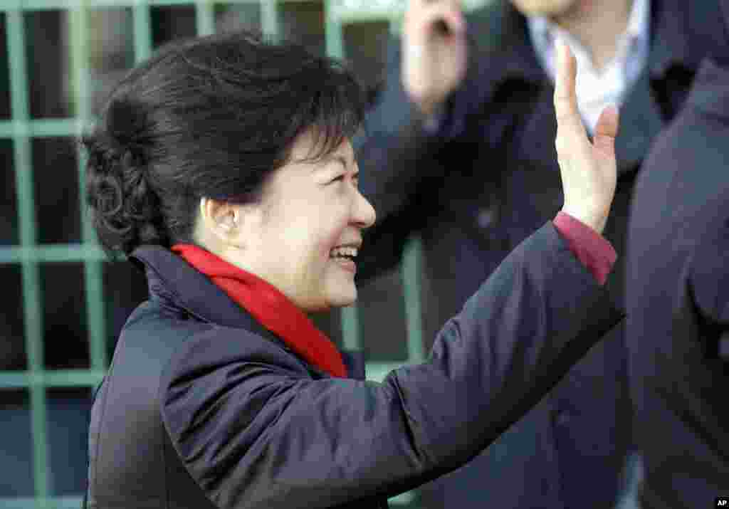South Korea's presidential candidate Park Geun-hye of the ruling Saenuri Party waves to her supporters upon her arrival to cast her ballot for the presidential election at a polling station in Seoul, South Korea, Wednesday, Dec. 19, 2012.