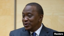 FILE - President Uhuru Kenyatta urged Kenyans "to not allow those who hide and abet the terrorists to compromise and even destroy the development that is fast growing in your area." 