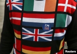 A man wearing a European-themed cycling jersey arrives to vote at a polling station in north London, Britain, June 23, 2016.