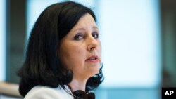 FILE - European Union Commissioner designate for Justice, Consumers and Gender Equality Vera Jourova speaks during a hearing at the Committee on Justice at the European Parliament in Brussels, Oct. 1, 2014. 