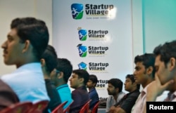 FILE - Entrepreneurs, employees and students listen to a speech during the Start-up saturday event at the Start-up Village in Kinfra High Tech Park in the southern Indian city of Kochi, Oct. 13, 2012.