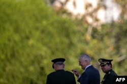 U.S. Defense Secretary Jim Mattis, center, is pictured during a visit to the WWII Veteran's Monument in Rio de Janeiro, Brazil on August 14, 2018.