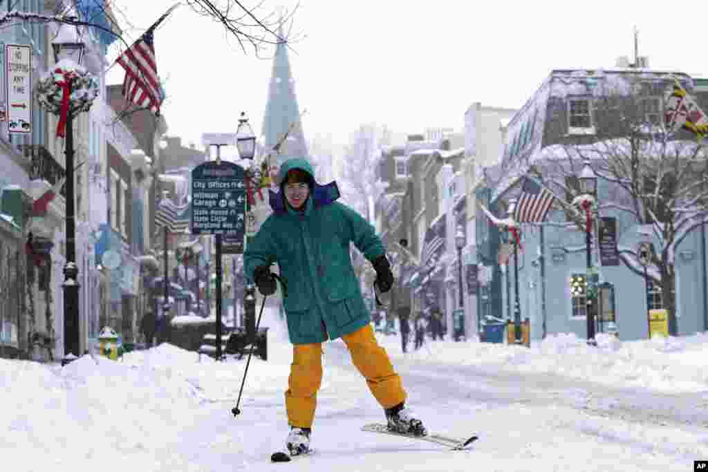 Cosimos Cendo, of Washington, D.C., skis down Main Street in Annapolis, Maryland, during a snow storm.