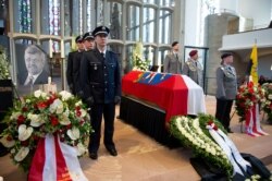 An honor guard made up of police and federal officers stands next to the coffin of Kassel District President Walter Luebcke, during his funeral at the St. Martin's Church in Kassel, Germany, June 13, 2019.