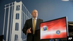 FBI Special Agent Jack Bennett, seen in this Sept. 27, 2016 photo, answers a question while posing in one of the bureau's modernized offices in San Francisco. He was key figure in San Bernardino iPhone hack.