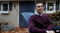 Joshua Pickar, of Lexington, Mass., one of 32 new Rhodes scholars from the U.S., sits for a photograph, Nov. 20, 2016, in Lexington. 