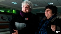 Veronica de Negri (L), mother of photographer Rodrigo Rojas de Negri, killed during the Pinochet dictatorship and Alicia Lira, president of the Association of Relatives of Political Prisoners Executed leave a court in Santiago, Chile, July 24, 2015.