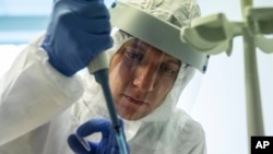 FILE - In this file photo dated Friday, Aug. 7, 2020, a medical worker performs a COVID-19 test at a test centre at Vnukovo airport outside Moscow, Russia. The World Health Organization’s Europe office senior emergency official Catherine Smallwood,…