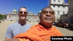 Activist monk Luon Sovath and Chris Kelly in front of the Household Cavalry Museum in London, England. (Courtesy of Luon Sovath)