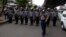 FILE - Police officers stand in position to block activists during a rally in Yangon, Myanmar, May 12, 2018.