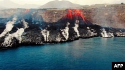 This image grab taken from a video provided by the Spanish Institute of Oceanography shows an aerial shot from the oceanographic vessel Ramon Margalef (IEO) of the delta formed on the coast from the lava of the Cumbre Vieja volcano, on the Canary Island of La Palma on October 4, 