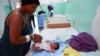 A Haitian mother tends to her baby after giving birth at a local hospital, in Santo Domingo, Dominican Republic Jan. 17, 2025. 