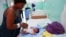 A Haitian mother tends to her baby after giving birth at a local hospital, in Santo Domingo, Dominican Republic Jan. 17, 2025. 