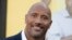 FILE - Actor Dwayne Johnson attends the premiere of his film "Central Intelligence" in Los Angeles, June 10, 2016. Johnson's income has swelled from upfront fees for "Central Intelligence" and "Fast 8," as well as the forthcoming "Baywatch," Forbes magazine said.