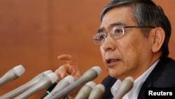 Bank of Japan Governor Haruhiko Kuroda speaks during a news conference in Tokyo. He stressed that the Japanese government must keep up efforts to restore the country's fiscal health, August 8, 2013.
