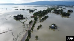 In this aerial photo, inundated houses are seen in Sunamgong, Bangladesh, July 14, 2020.