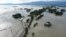 In this aerial photo, inundated houses are seen in Sunamgong, Bangladesh, July 14, 2020.