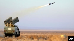 In this photo provided Jan. 12, 2025, by the Iranian Army, a missile is launched during a drill in Iran.